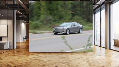 Luxury Sedan Traveling Down The Road Wall mural