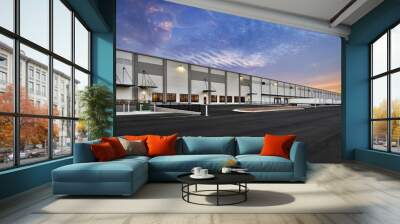 Modern warehouse distribution center at sunset Wall mural