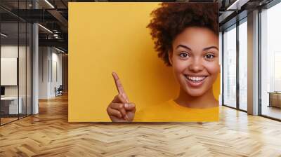 young woman smiling, pointing finger, solid background, Wall mural