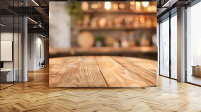 A wooden table with a blurry background and a few potted plants. The table is round and has a wooden surface Wall mural