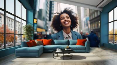 Beautiful business woman going to work holding cup of hot drink in hand and bag walking near office building. portrait of a successful business smiling woman person on her way to work on a city street Wall mural