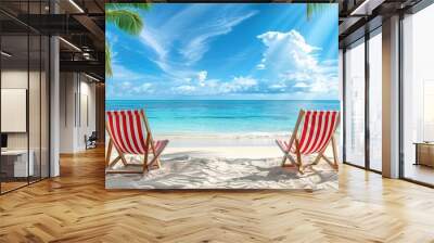 Two red and white striped beach chairs on sandy beach with palm trees, blue sky, and clear sea, seaside summer vacation. Copy space. Wall mural