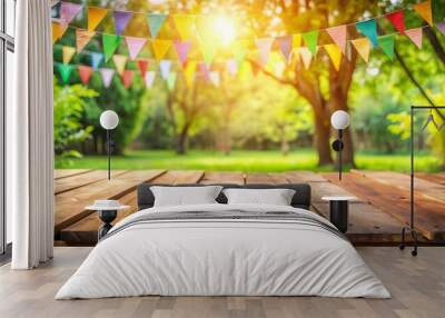 Wooden Table with Colorful Bunting Flags in a Sunny Park, summer , party , festive , outdoors Wall mural