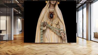 Well, Netherlands - September 30, 2020: Beautiful painted Virgin Mary statue from a catholic chapel isolated on black background Wall mural