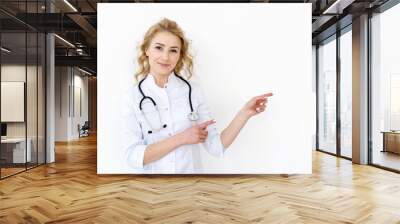 Doctor in white uniform against white background Wall mural