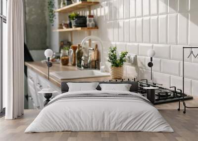 Kitchen in white tones with stove, sink and shelves Wall mural