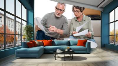 mature couple holding current expense document and fill tax form Wall mural