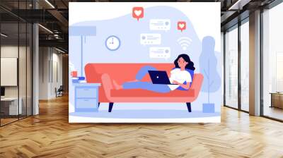 Beautiful woman relaxing at sofa with laptop computer flat vector illustration. Young girl staying at home and chatting with friends via digital device. Digital technology and entertainment concept. Wall mural