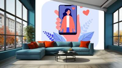 Male hand holding smartphone with woman photo. Love, heart, phone flat vector illustration. Social media and digital technology concept for banner, website design or landing web page Wall mural