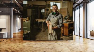 Image of mature carpenter in the workshop Wall mural