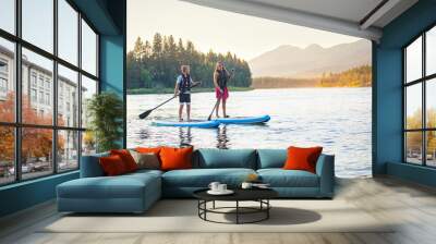 Family Paddle boarding together on a Beautiful Mountain Lake Wall mural