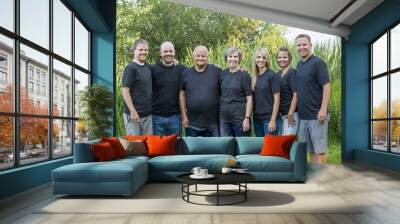 portrait of a senior couple with their five adult children. This large attractive family of adult children with their senior parents Wall mural