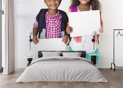 Two cute kids holding up a blank sign Wall mural