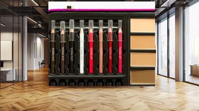 Close-up of a make-up case with eyeliner pencil, lip liner and compact foundation cream. Wall mural