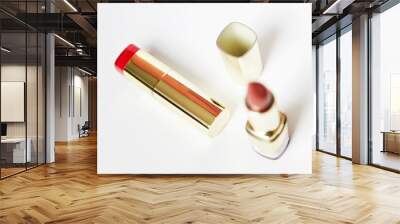 Red lipstick in golden tube isolated on white background. Make up product. Wall mural