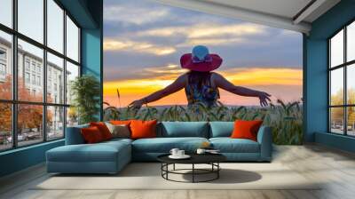 Happiness woman stay outdoor under sunlight of sunset Wall mural