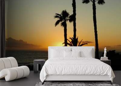 Palm tree silhouette on beach sunset Wall mural