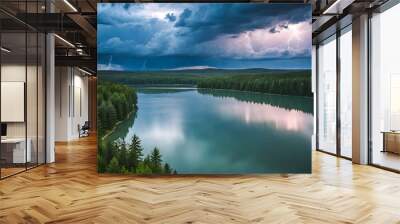 Aerial view of a river in the middle of a forest. A stormy sky with large gray clouds and lightning. Wall mural