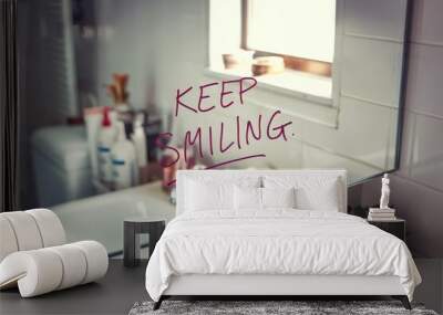 Positive message 'KEEP SMILING' written on a bathroom mirror. Wall mural