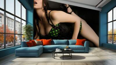 Sexy Beauty on Black Couch Wall mural