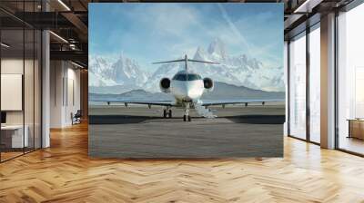 private jet airplane on the ground waiting to be boarded
snowy mountains in the background Wall mural