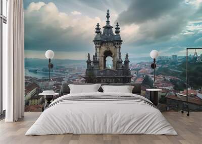 Aerial view of a historic tower amidst a scenic cityscape with clouds above. Wall mural