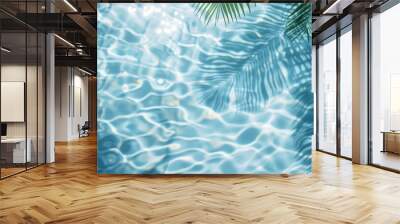 abstract blue water ripples with palm leaf shadow summer vacation beach background from above top view sunny day Wall mural