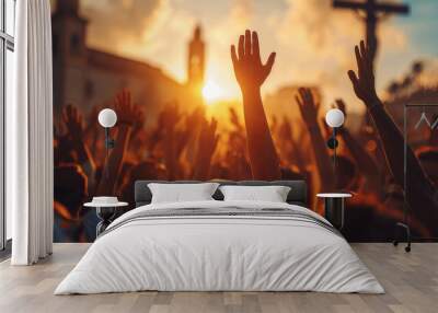 Crowd Raising Hands During Sunset Religious Event With Cross In Background Wall mural