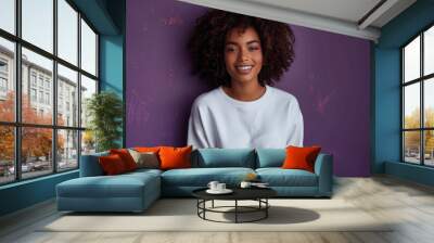 Smiling Black Woman in White Sweatshirt and Jeans on Purple Background Mockup Template Wall mural