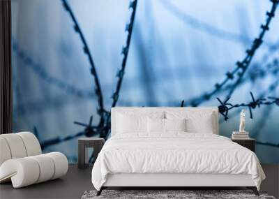 Protective fencing specially protected object of barbed wire. Stamped barbed wire. Wall mural