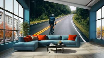 Selective focus shot of professional road cyclist riding down wet and windy mountain road in forest, on aero road bike from carbon Wall mural