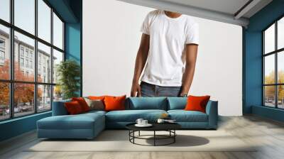 Unlabeled white cotton t-shirt presented on a muscular body of a young athlete Wall mural