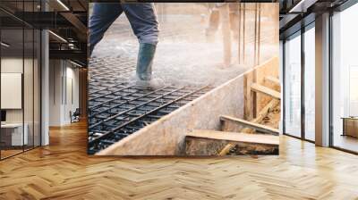 Concrete pouring during commercial concreting floors of buildings in construction Wall mural