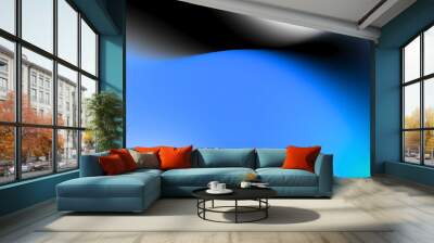 Dynamic gradient with blue and black tones, providing a bold and futuristic visual for creative projects. Wall mural