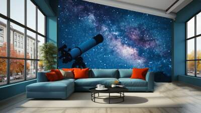 Stargazing with a telescope under a clear night sky Wall mural