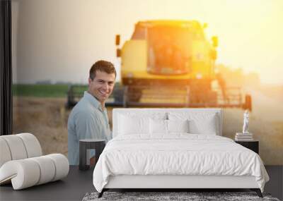 Agricultural engineer on wheat harvest Wall mural