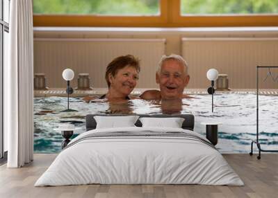 Elderly couple in pool Wall mural