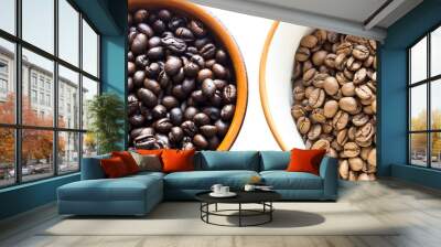 two different types of coffee beans with different roast in cups on a white background Wall mural