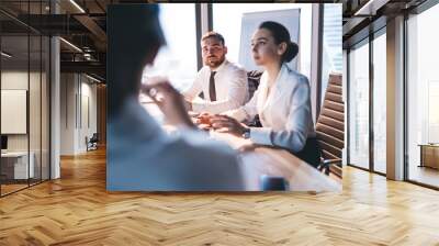 Attentive coworkers sitting at meeting in conference room Wall mural