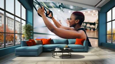 Black short haired training woman Wall mural