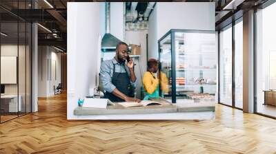 Black workers of modern cafe in city Wall mural