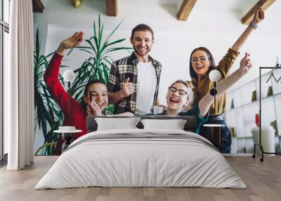 Cheerful friends celebrating homework fulfillment Wall mural