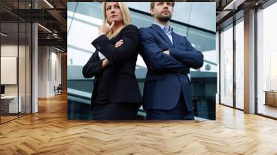 Confident business team of man and woman standing with crossed hands, team spirit concept, couple of success business people ready to act, business manager and employee,ready to implement plans Wall mural