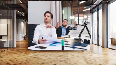 Confident businesspeople working on project together Wall mural