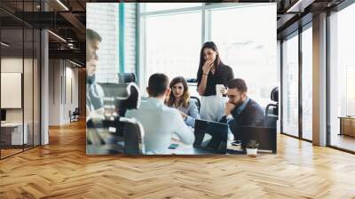 Confident male and female business owners discussing trade accounting and management strategy for company, young group of people in formal wear collaborating together during teamwork in office Wall mural