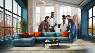 creative group of designers coworking in loft office Wall mural