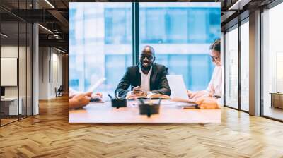 Divers employees having meeting in office Wall mural