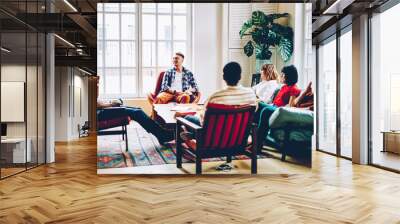 Diverse friends gathering in spacious living room Wall mural