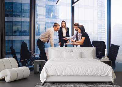 Male and female professionals teamworking during brainstorming cooperation on paper documents, group of diverse employers discussing corporate investment of firm capital briefing in conference room Wall mural