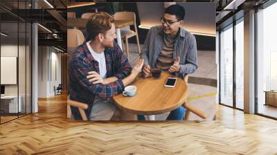 Multiracial business men working in office space Wall mural